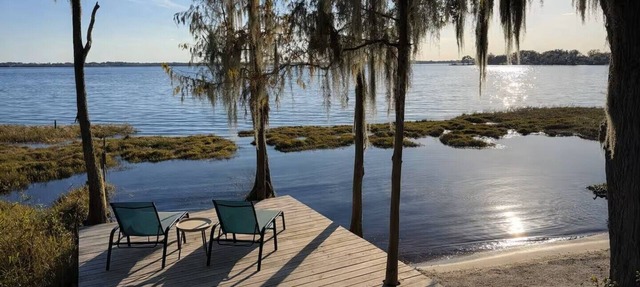 Lakeshore Sunset Home with Heated Pool & Beachfront Near Downtown Clermont in Clermont