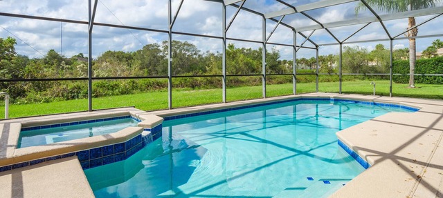 Luxury 5 bed 4 bath SW facing pool with conservation and lake view in Clermont