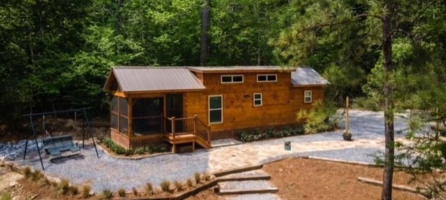 Secluded cozy tiny cabin on the water with fire pit and private dock in Pearl River