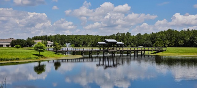 Water view retreat with lanai, heated pool, pool spa, game room, & AC in Kissimmee