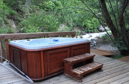 Sundance Cottage | Quiet streamside retreat Hot Tub Deck overlooking the creek Wood-burning Fireplace insert Tucked below Sundance